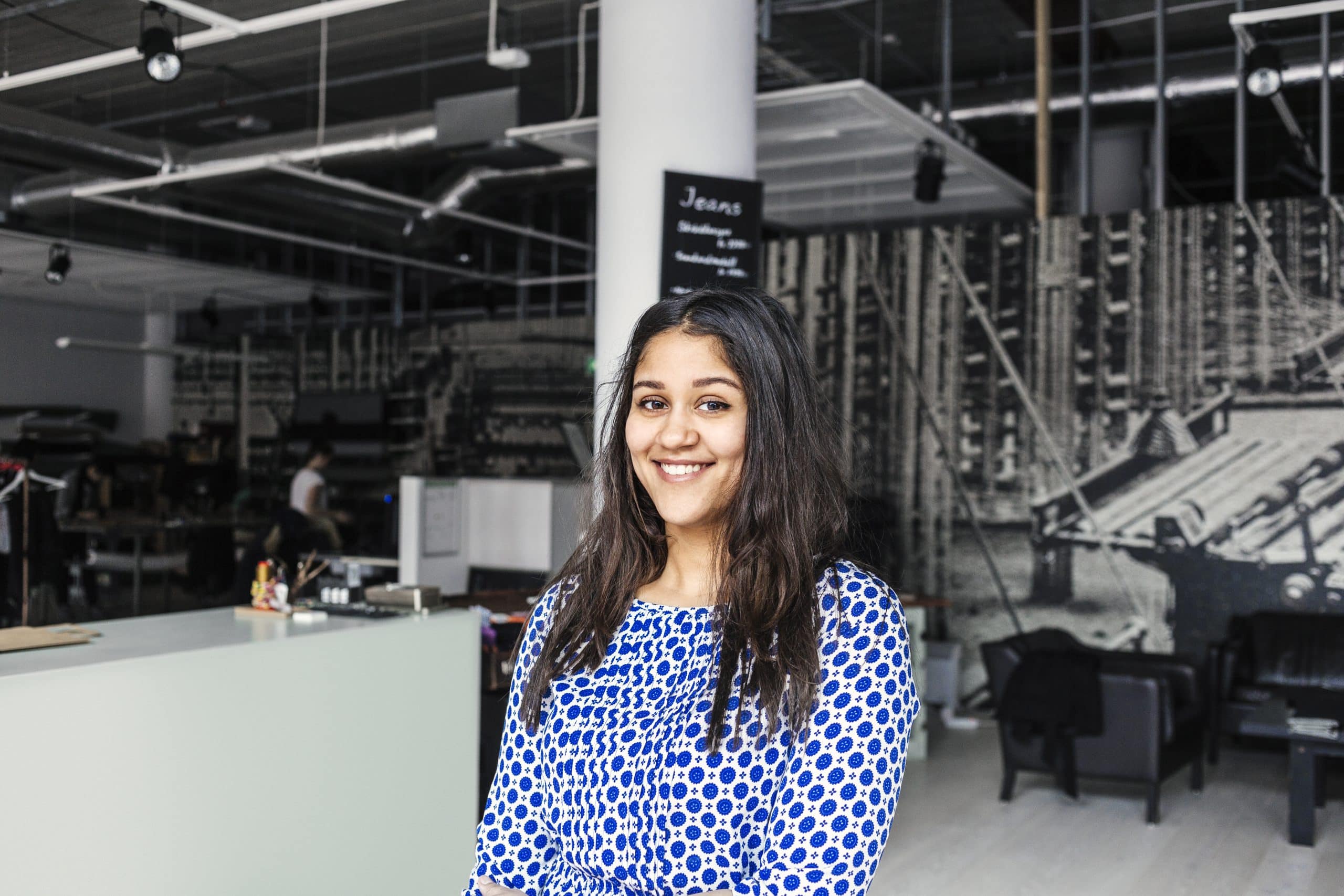 Portrait of happy female customer in factory