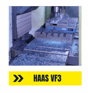 HAAS VF3 Machining Steel Parts with High Volume Output - Accurate Metal Stamping HAAS VF3 machining large metal components with visible chips