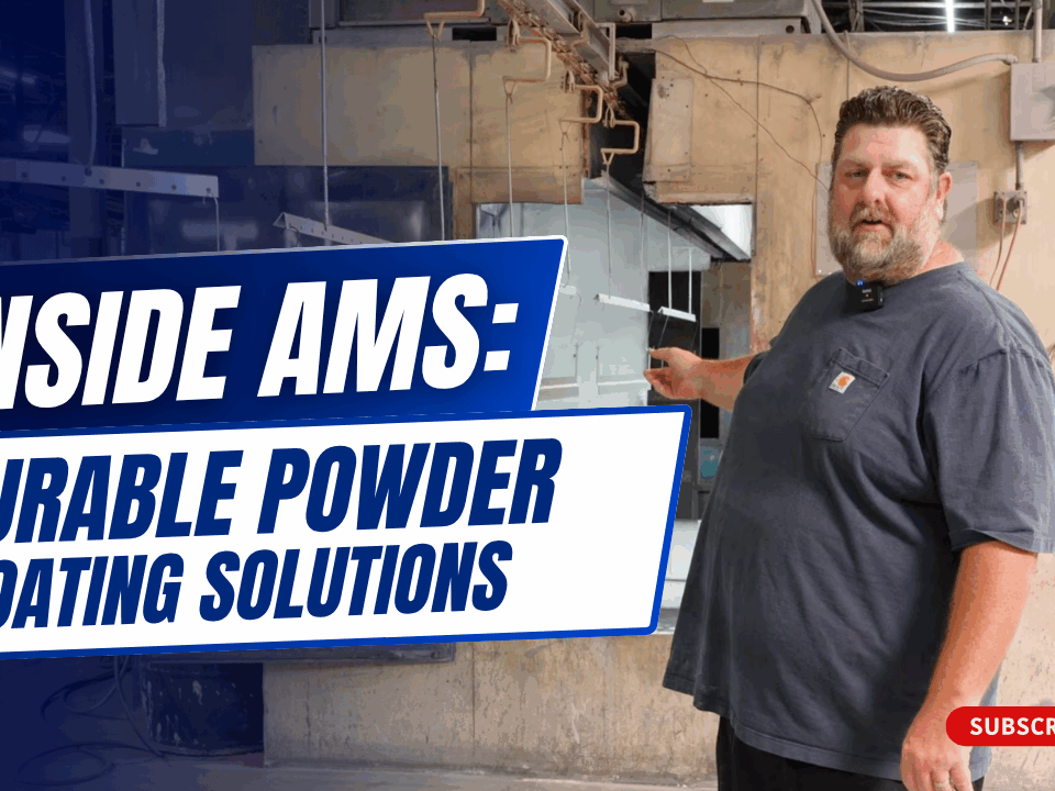 Josh Romberg standing in front of AMS powder coating system