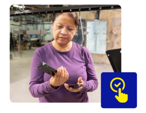 Quality Inspection of Welded Metal Components at AMS - Accurate Metal Stamping Technician inspecting welded metal component as part of AMS welding services