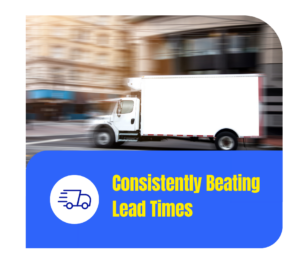 Consistently Beating Lead Times - Accurate Metal Stamping A white delivery truck drives through a city street, representing reliable delivery and consistently fast lead times.